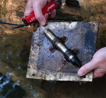 this levelogger was secured to the bottom of a river using a metal plate and a cinder block