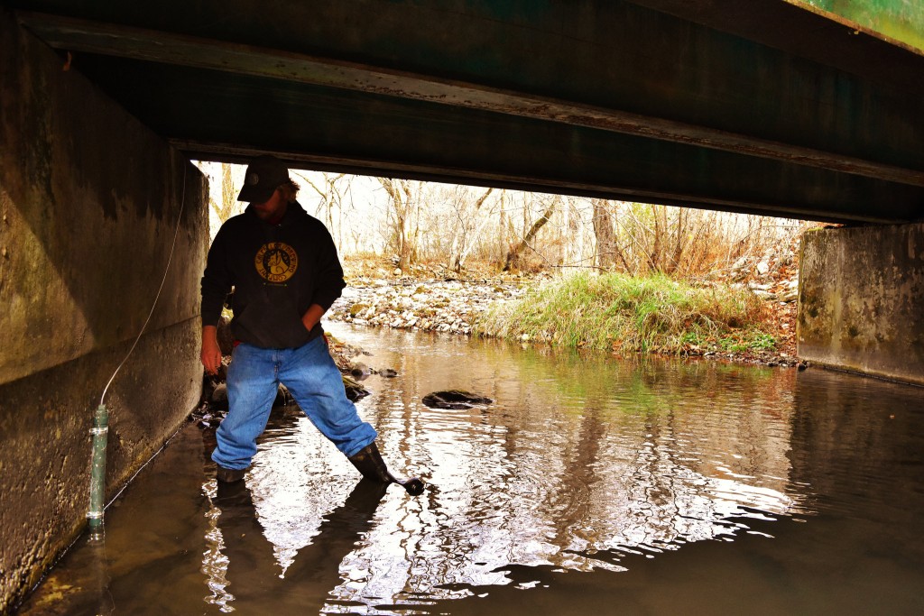 installing stilling well at head of squatchie sping