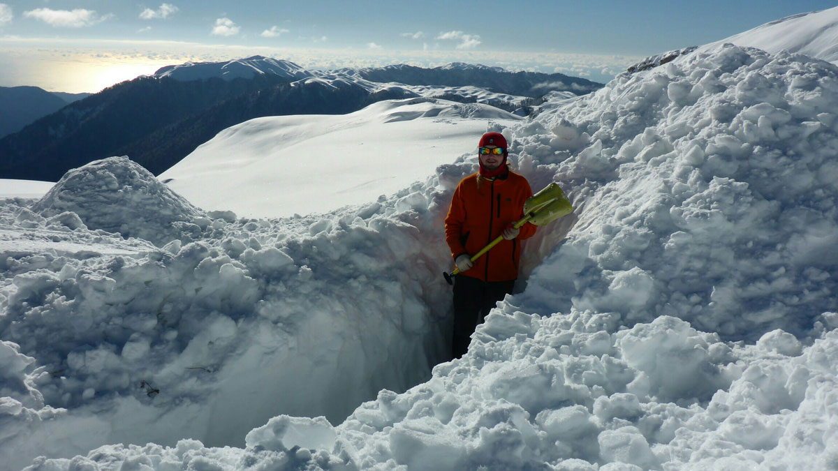 an igloo being built at the sarma cave camp