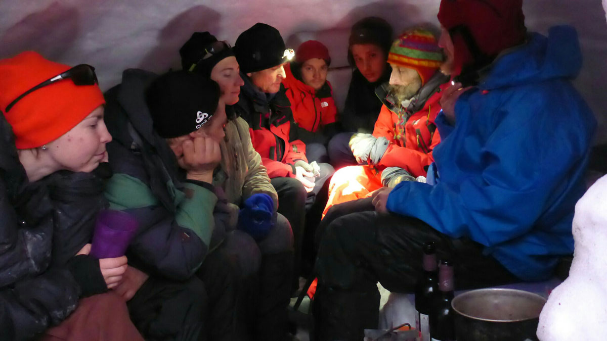 expedition participants in the snow kitchen after completing the cave exploration