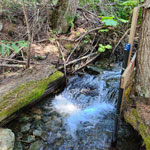 aerated stream with water level measurement devices installed in stilling wells