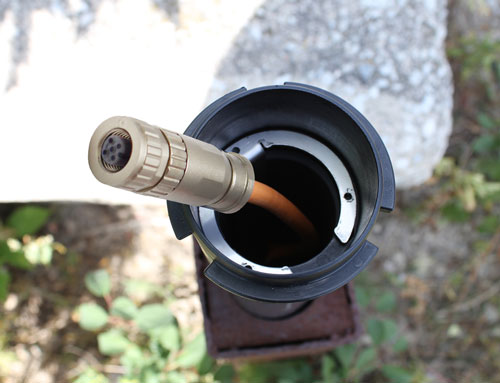 sliding the well cap sleeve up to the wellhead