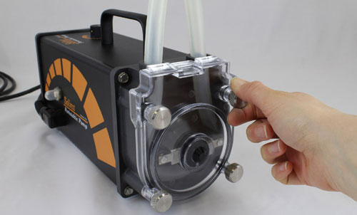 position the solinst peristaltic pump head cover and screw it firmly in place by hand