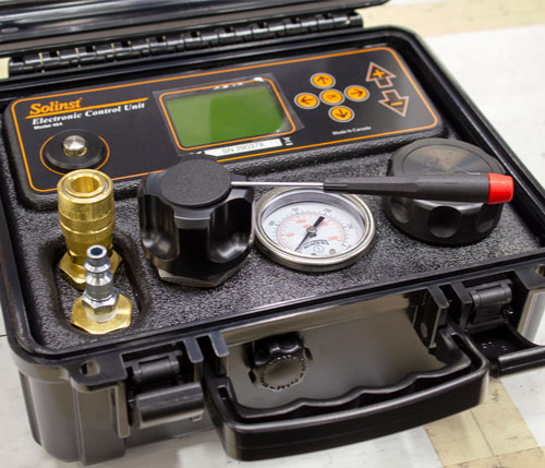 image showing how to use small flathead screwdriver to pry the plug from 464 electronic pump control unit pressure regulator knob