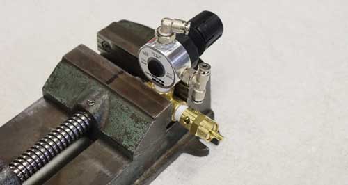 unscrew the Pressure Regulator from the brass tee