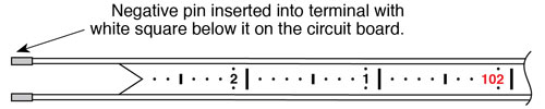 solinst water level meters flat tape pin inserted into terminal with white square below it on the circuit board