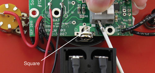 Connect the tape to the new solinst water level meter circuit board assembly by pressing down on the white terminals on the circuit board and inserting the tape leads