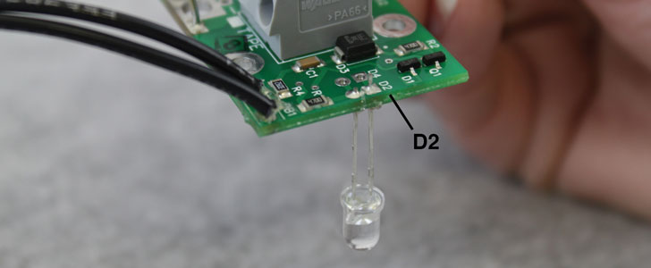 insert the leads of the new light into the two positions labelled d2 on the circuit board and solder in place