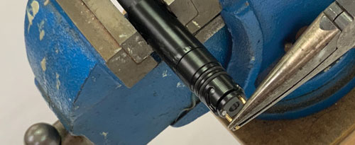 use pliers to pull out the two brass tubes and the black disk from the solinst meter tape seal plug