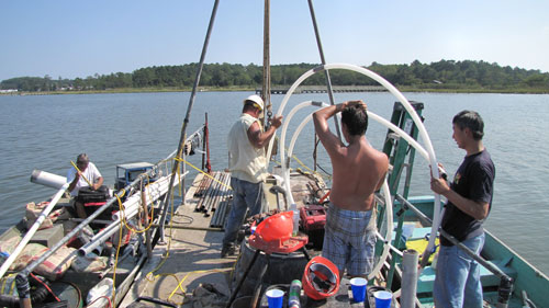 cmt systems were installed at the bottom of a bay to measure submarine groundwater discharge eight 7 channel cmt systems were installed with custom modifications to suit the open water application. watertight wellheads had to be custom built to allow for sampling from the surface of the bay using a peristaltic pump