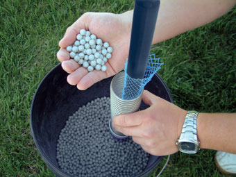 pouring bentonite pellets into cmt multilevel system spring cartridge