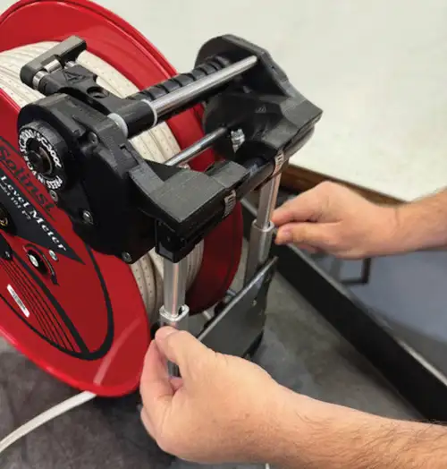 Reconnect The Telescoping Arm Of The Power Winder To The Frame And Tighten The Thumbscrew reconnect the telescoping arm of the power winder to the frame and tighten the thumbscrew