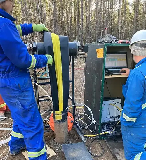 technicians monitoring transmissivity profiling data